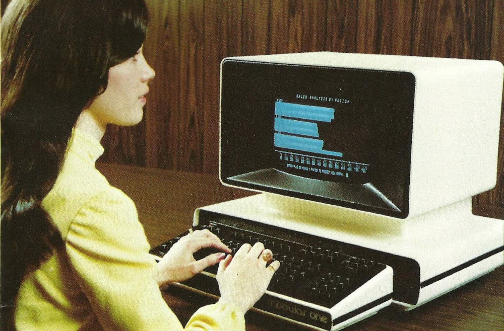 A woman using a Hazeltine Module One computer, released in 1976.